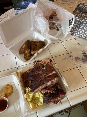 Ribs, sausage, potato salad, boudin, baked beans, and the fixins