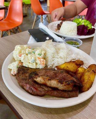 Top Sirloin - Picanha with sides of sweet plantains, rice & potato salad