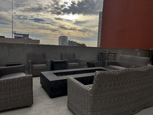 The rooftop deck above the parking structure is the perfect height and has everything from a fire pit to a grill and bar!