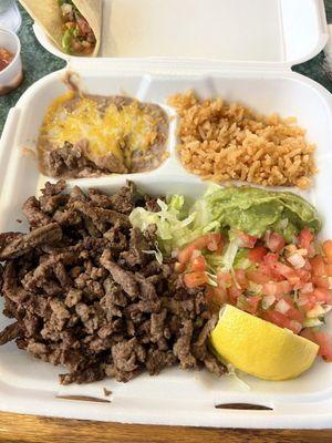 #4 Carne Asada with corn tortillas. Pico de gallo, lettuce, rice and beans.