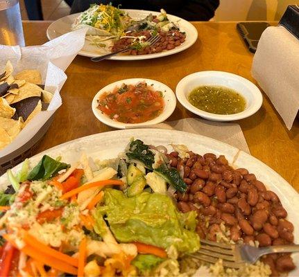 Vegan bowl, chips and salsa, chicken tacos with veggies and beans