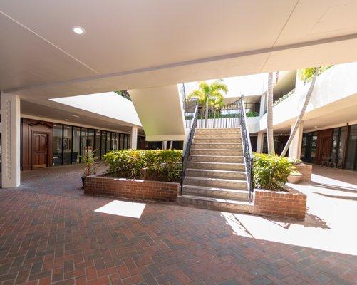 A view from the courtyard with the main entrance to our office off to the left of the image.