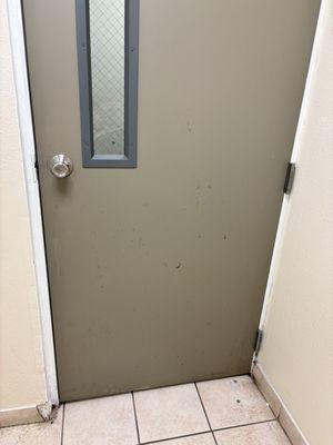 Laundry room door has stains