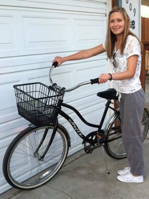 Loving her new bike - wine colored single speed cruiser.  We bought the basket at Good Karma Bikes to go along with the bike.