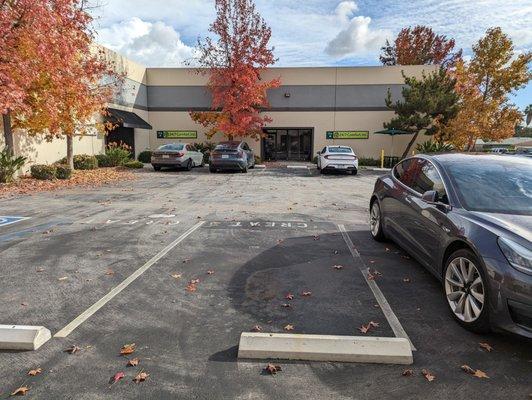 Parking lot. Spaces are designated for each tenant.