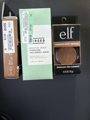 In this photo, you will find two elf bronzers, one showing the price and one showing the product and Versed moisturizing serum.