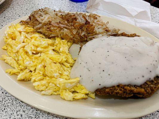 Country fried steak w/white gravy, hash browns, & scrambled eggs