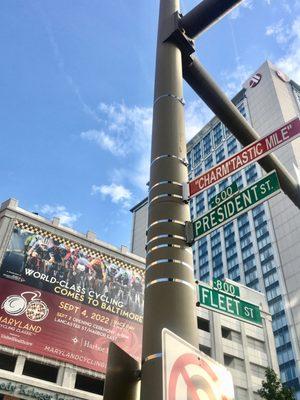 The Maryland Cycling Classic Promo-Poster on The "Charm'tastic Mile" entering Harbor East.