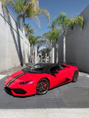 Huracan evo wrapped in Carmine red, 1016 industries wing, custom cat back novara exhaust