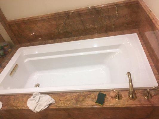 Replace old jacuzzi with New drop in tub with gold trim and faucet