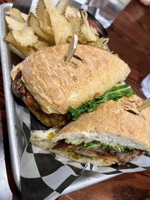 crispy pork belly sandwich, served with kettle chips