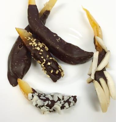 Incredible dark chocolate dipped orange peel sprinkled with nuts, white chocolate curls n gold sugar