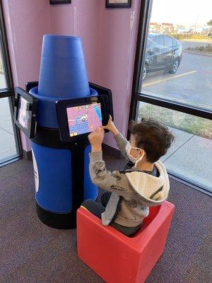 Children's waiting area with an iPad station.