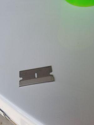 Razor blade my Son pulled out of a cup holder next to his seat in our purchased vehicle