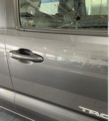 Someone at the dealership keyed our car, then decreased their trade-in offer by $1000. This scratch was not there prior!