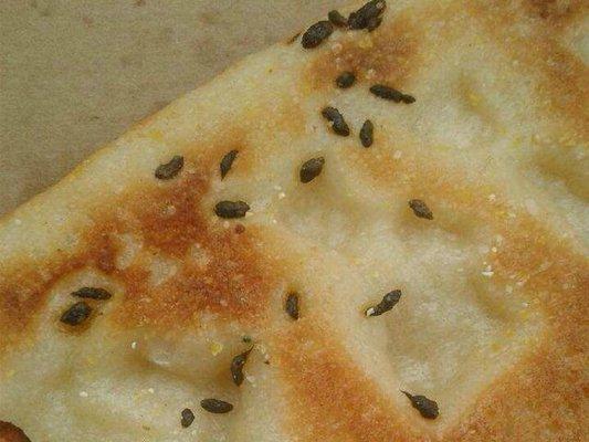 I ordered cheese pizza and this is what i got. RAT FECES in it.. Kawal the owner was very vulgur. Not fair!!