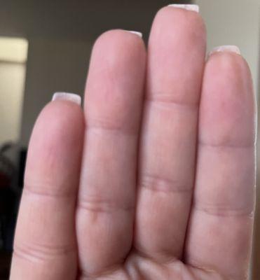 Middle nail not straight.