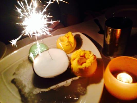 Birthday dessert. Delicious assortment of mango, coconut and pistachio ice creams.