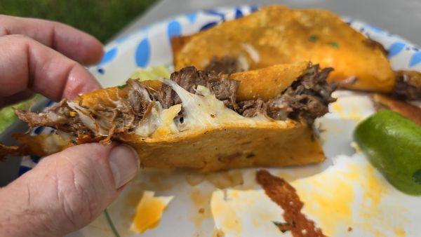 #1 Birria tacos.  Meat and cheese stuffed, then fried, dipping consomme on the side