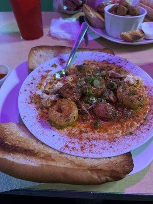 I enjoyed the shrimp and grits, it had andouille sausage the right amount of spice included two slices of bread. I recommend this meal.