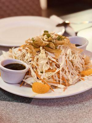 Asian salad topped crispy wontons, peanuts and a soy dressing