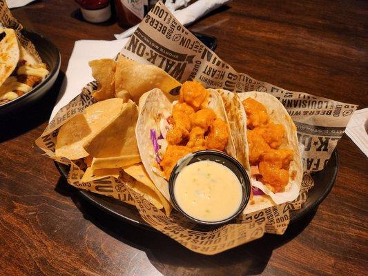 Boom Boom Shrimp Tacos with chips and dip.