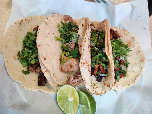 Lengua, carnitas, al pastor, and chorizo tacos