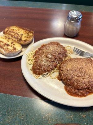 Veal Parmesan, spaghetti and garlic bread.