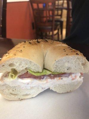 Everything bagel with lox cream cheese and lettuce, tomato, and onion.