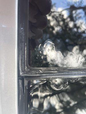 Hmmm... a splitting sunroof seal. Could possibly be where rain is LEAKING INTO THE CABIN OF A NEW $55K VEHICLE? Nah, probably not.