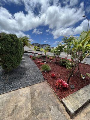 Plant removal and pruning.Gravel and red cinder installation