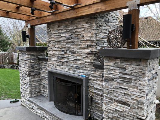 An outdoor fireplace built by Best Way Masonry.