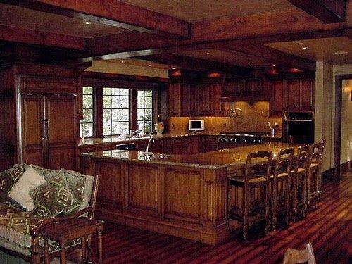 Great example of a kitchen with fully paneled appliances and integrated wine storage.