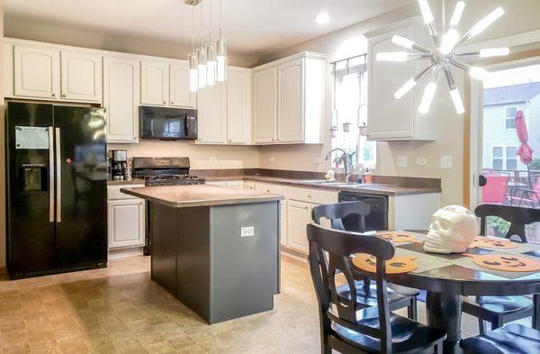 These maple cabinets now have a new lease on life after we were done painting them.