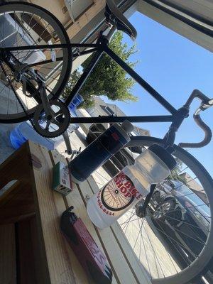 The Bike Shop Water bottle, bike tool kit and solution to clean chain.