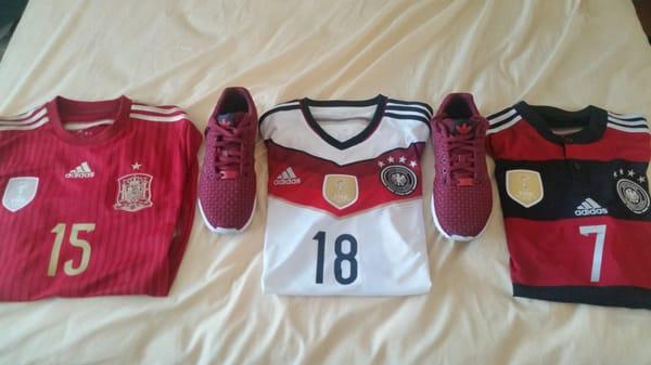 Red Adidas Originals ZX Flux with two Adidas soccer jerseys of the last 2 countries that won the World Cup: Spain & Germany.