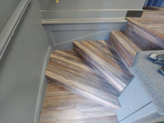 Staircase to stage. Done in a vinyl plank floor.