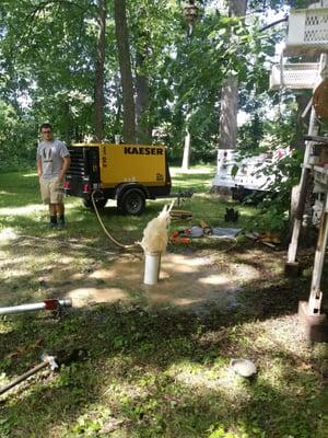 a 5" well being cleaned with a air surge method