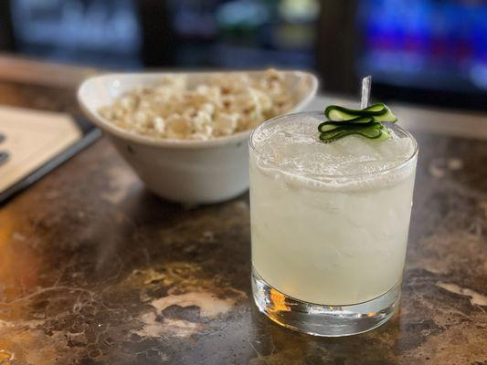 Cucumber gimlet with truffle popcorn.