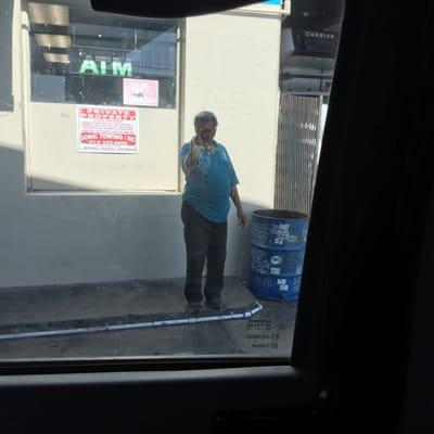 This guy was smoking inside, where customers pay putting his ashes in same trash used for coffee.