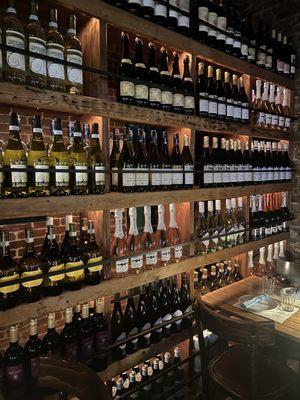 Wall of wine that blocks off the restroom