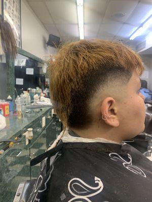 Burst Haircut with a Rattail Style