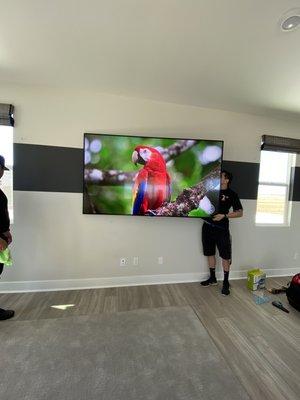 They brought two guys to install my TV with amount and re-mounted and installed five other TVs I had within 3 hours.