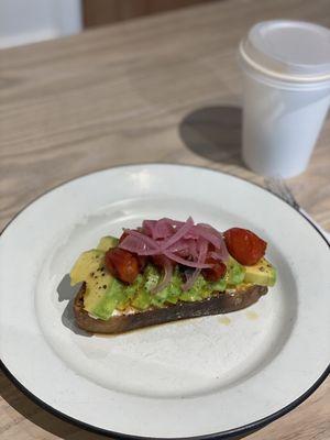 Avocado Toast has cream cheese, pickled onions, tomato, black pepper and avocado on delicious fresh bread.