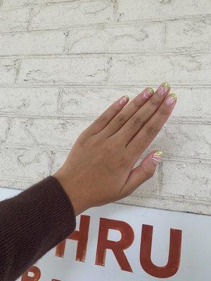 French tip manicure with wavy line design