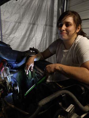 carrie working on an oil pump replacement