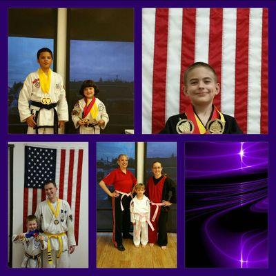 Students showing off Tournament medals and support for the Pink Belt Revolution