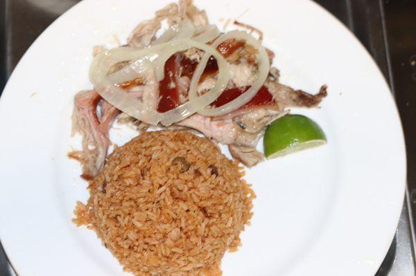 Yellow rice and juicy fried pork