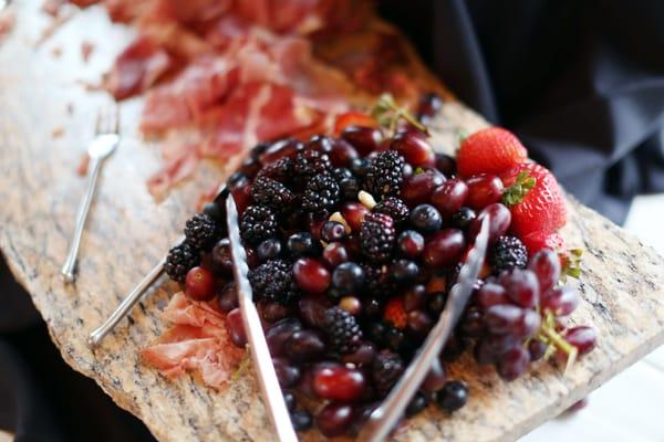 Fresh Fruit, cheese, cured meats, breadsticks and bacon wrapped dates and brisket stuffed mushrooms for cocktail hour.