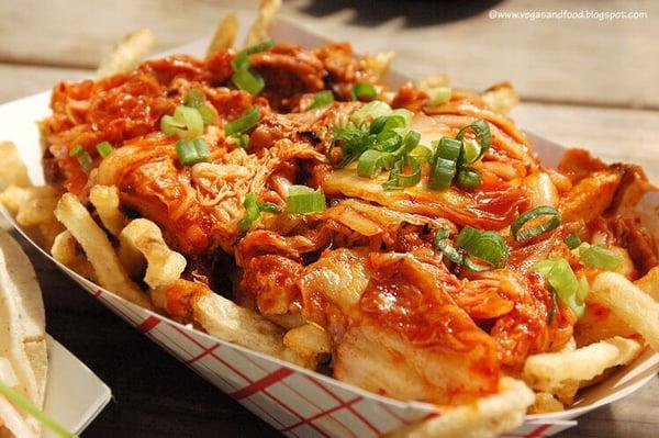 Try our very own Kimchi Fries! French fries served with caramelized kimchi, cheese wiz, and fresh-cut scallion.